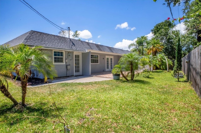 6931 Magellan Way, Sarasota, FL 34243 - rear view of property with french doors, roof with shingles, mansard roof, a patio area, and stucco siding