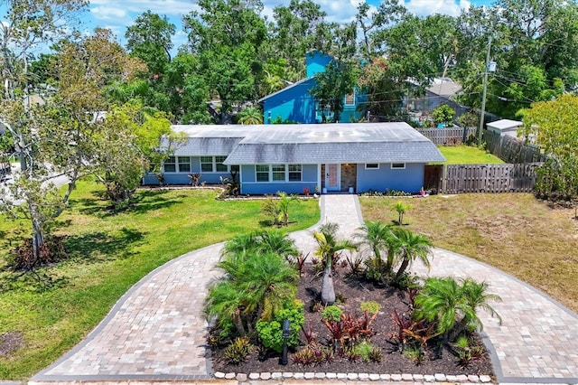 6931 Magellan Way, Sarasota, FL 34243 - view of front of home with decorative driveway and roof with shingles
