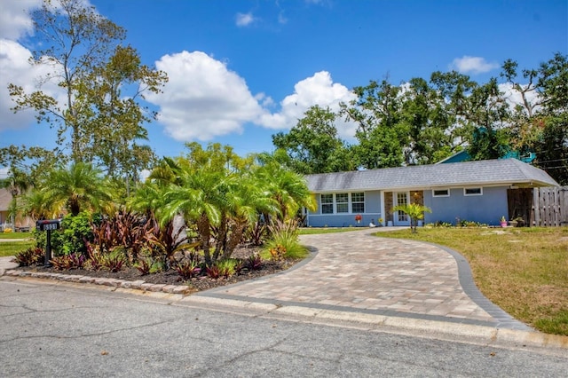 6931 Magellan Way, Sarasota, FL 34243 - view of front of property with decorative driveway and stucco siding