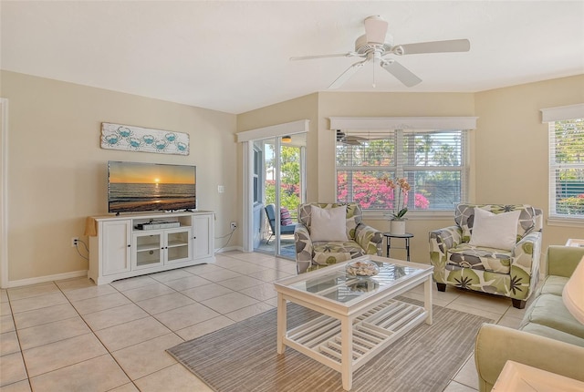 1226 Siesta Bayside Dr Unit 1226C, Sarasota, FL 34242 - living room with light tile patterned floors, baseboards, and ceiling fan