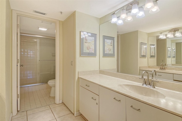 1226 Siesta Bayside Dr Unit 1226C, Sarasota, FL 34242 - bathroom featuring tile patterned flooring, a stall shower, toilet, and vanity