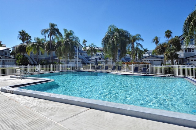 1226 Siesta Bayside Dr Unit 1226C, Sarasota, FL 34242 - community pool featuring a residential view and fence