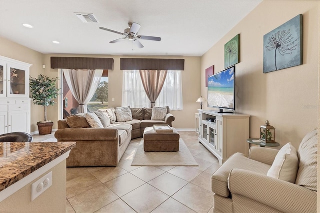 11507 84th Street Cir E Unit 102, Parrish, FL 34219 - living room featuring ceiling fan, light tile patterned floors, and baseboards