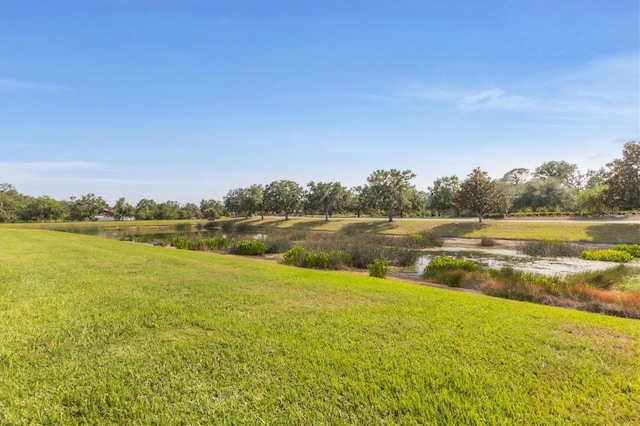 11507 84th Street Cir E Unit 102, Parrish, FL 34219 - view of grassy yard featuring a water view