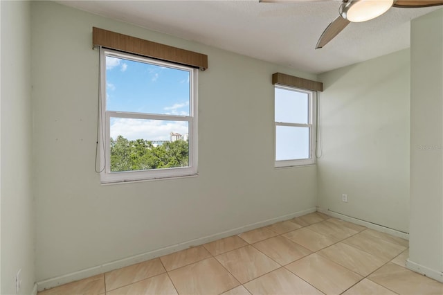 33 S Gulfstream Ave Unit 502, Sarasota, FL 34236 - tiled empty room with ceiling fan and a textured ceiling