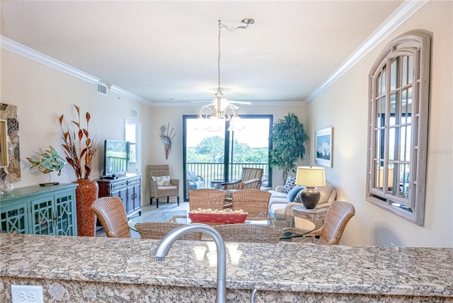 7005 River Hammock Dr Unit 204, Bradenton, FL 34212 - dining room featuring a chandelier and ornamental molding