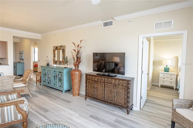 7005 River Hammock Dr Unit 204, Bradenton, FL 34212 - living area featuring arched walkways, ornamental molding, wood finished floors, and baseboards