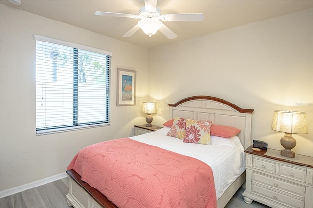 7005 River Hammock Dr Unit 204, Bradenton, FL 34212 - bedroom featuring light wood-style flooring, baseboards, and a ceiling fan