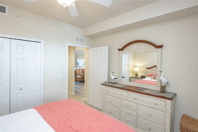 7005 River Hammock Dr Unit 204, Bradenton, FL 34212 - bedroom with arched walkways, a closet, and ceiling fan