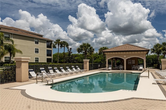 7005 River Hammock Dr Unit 204, Bradenton, FL 34212 - community pool with a patio area, a gazebo, and fence