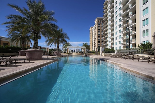 community pool with a patio area