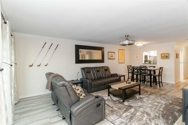 6999 W Country Club Dr N Unit 224, Sarasota, FL 34243 - living area featuring crown molding, baseboards, and light wood-type flooring