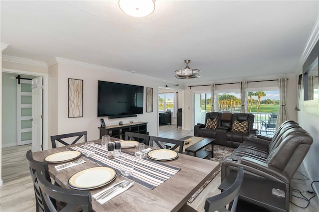 6999 W Country Club Dr N Unit 224, Sarasota, FL 34243 - dining area featuring crown molding, light wood finished floors, baseboards, and a barn door