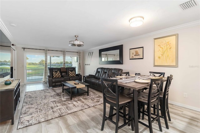 6999 W Country Club Dr N Unit 224, Sarasota, FL 34243 - dining room with crown molding and baseboards