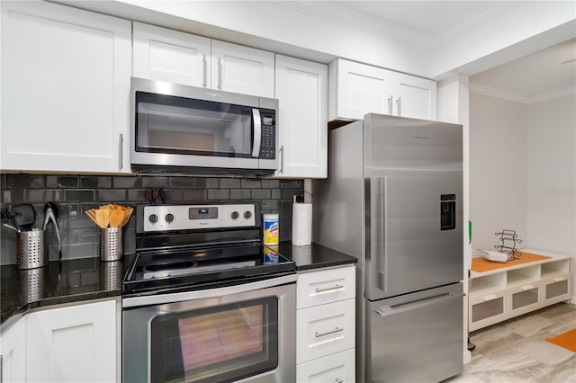 6999 W Country Club Dr N Unit 224, Sarasota, FL 34243 - kitchen featuring stainless steel appliances, ornamental molding, white cabinets, and tasteful backsplash