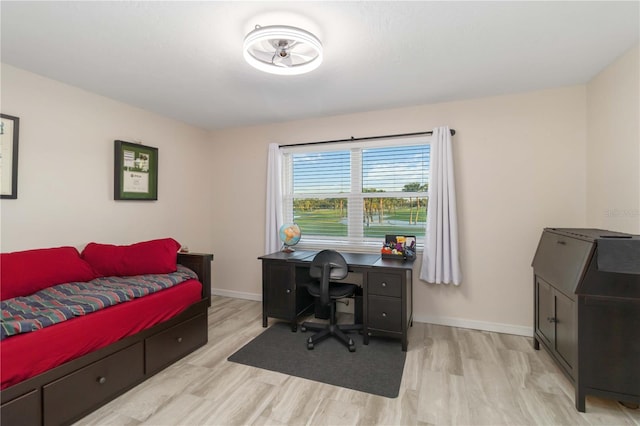 6999 W Country Club Dr N Unit 224, Sarasota, FL 34243 - bedroom featuring wood finished floors, baseboards, and an office area