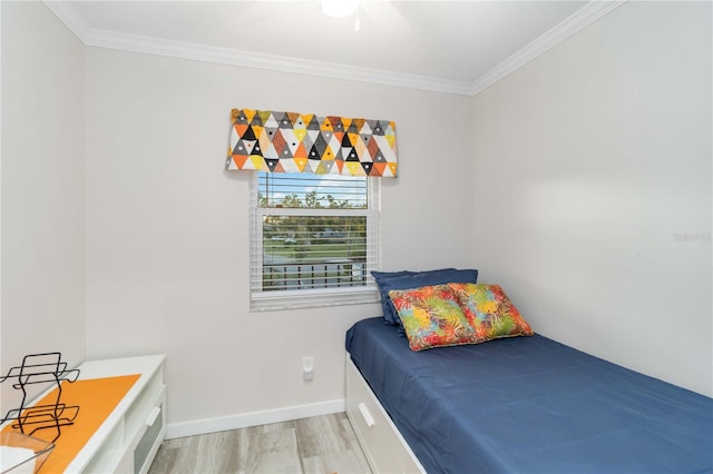 6999 W Country Club Dr N Unit 224, Sarasota, FL 34243 - bedroom with ornamental molding, wood finished floors, baseboards, and a ceiling fan