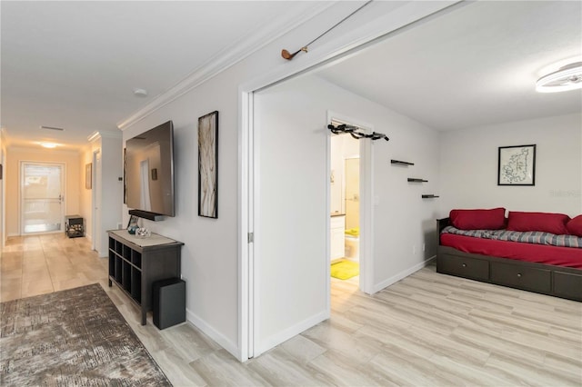 6999 W Country Club Dr N Unit 224, Sarasota, FL 34243 - bedroom with light wood-style floors, ornamental molding, baseboards, and ensuite bathroom