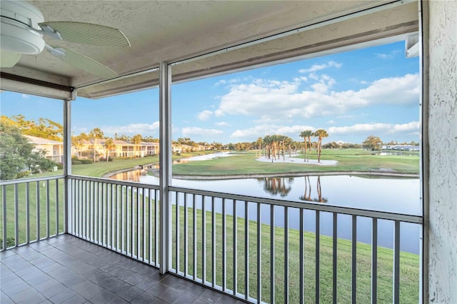 6999 W Country Club Dr N Unit 224, Sarasota, FL 34243 - unfurnished sunroom with ceiling fan, a water view, and golf course view