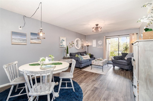 104 Capri Isles Blvd Unit 207, Venice, FL 34292 - dining space featuring wood finished floors