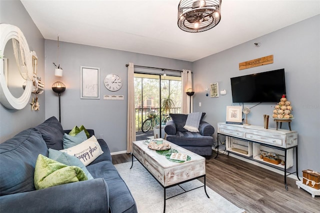 104 Capri Isles Blvd Unit 207, Venice, FL 34292 - living room featuring wood finished floors and baseboards