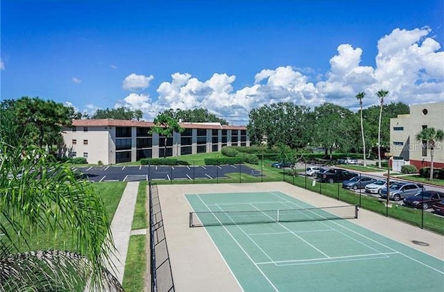 104 Capri Isles Blvd Unit 207, Venice, FL 34292 - view of tennis court featuring fence
