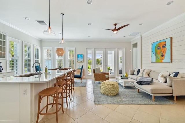 311 Compass Point Dr Unit 101, Bradenton, FL 34209 - living room with ornamental molding, light tile patterned floors, and recessed lighting