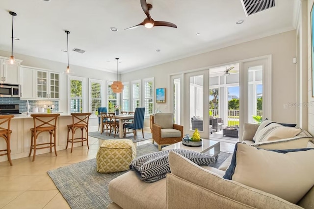 311 Compass Point Dr Unit 101, Bradenton, FL 34209 - living area with ceiling fan and light tile patterned flooring