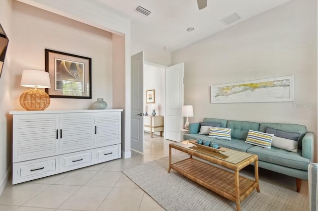 311 Compass Point Dr Unit 101, Bradenton, FL 34209 - living area featuring light tile patterned flooring, a ceiling fan, and baseboards