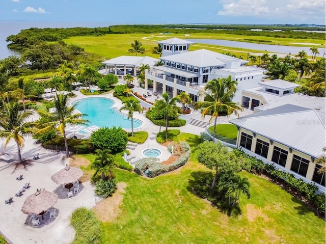 311 Compass Point Dr Unit 101, Bradenton, FL 34209 - drone / aerial view of a pool area and a nearby body of water