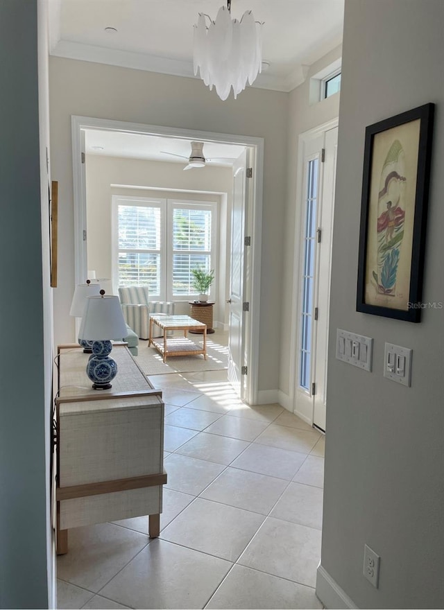 311 Compass Point Dr Unit 101, Bradenton, FL 34209 - hallway with light tile patterned floors, ornamental molding, and baseboards