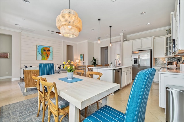 311 Compass Point Dr Unit 101, Bradenton, FL 34209 - dining space with light tile patterned floors, crown molding, and recessed lighting