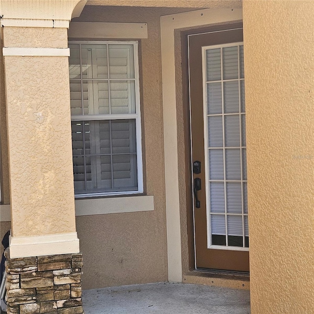 8110 Villa Grande Ct, Sarasota, FL 34243 - property entrance with stucco siding