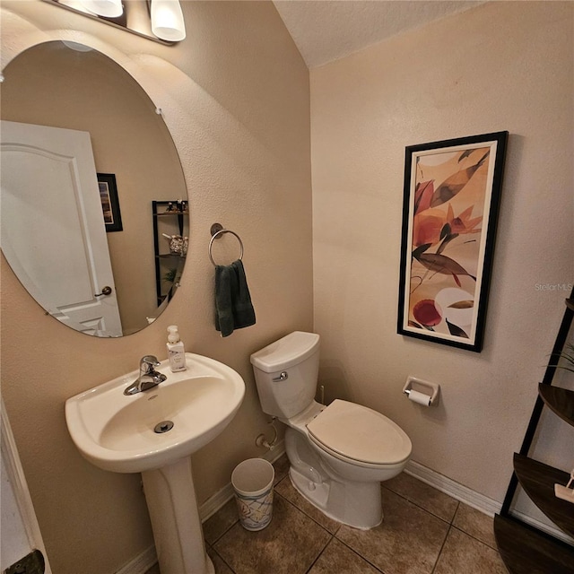 8110 Villa Grande Ct, Sarasota, FL 34243 - bathroom featuring toilet, tile patterned floors, and baseboards
