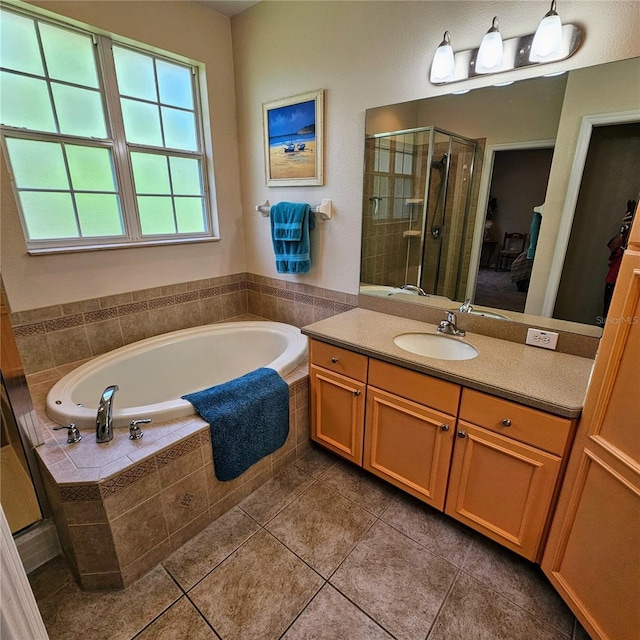 8110 Villa Grande Ct, Sarasota, FL 34243 - bathroom featuring a stall shower, a bath, vanity, and tile patterned floors