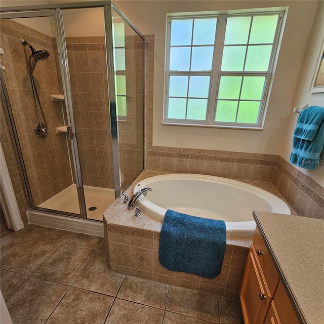 8110 Villa Grande Ct, Sarasota, FL 34243 - bathroom with a shower stall, a garden tub, tile patterned flooring, and vanity