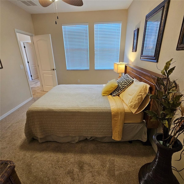 8110 Villa Grande Ct, Sarasota, FL 34243 - bedroom with light colored carpet, ceiling fan, and baseboards