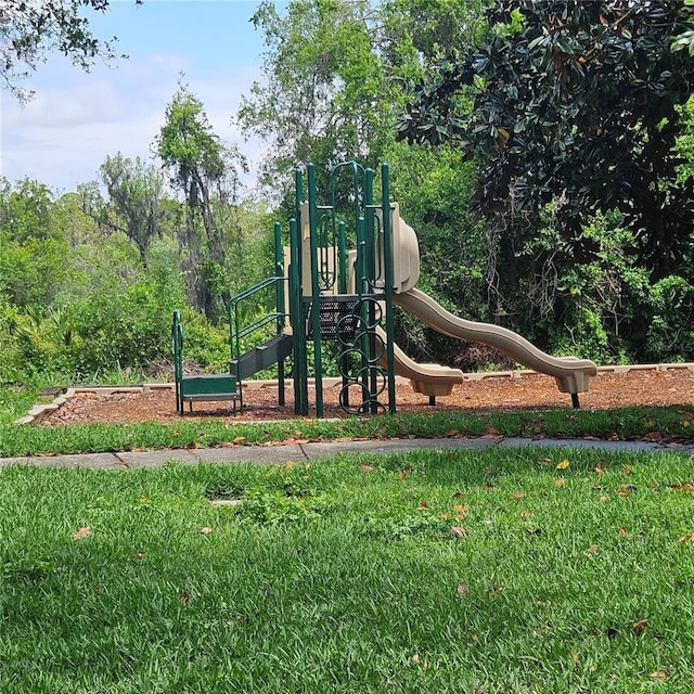 8110 Villa Grande Ct, Sarasota, FL 34243 - communal playground featuring a lawn