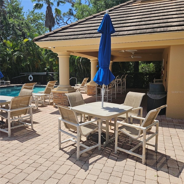 8110 Villa Grande Ct, Sarasota, FL 34243 - view of patio / terrace with a community pool and ceiling fan