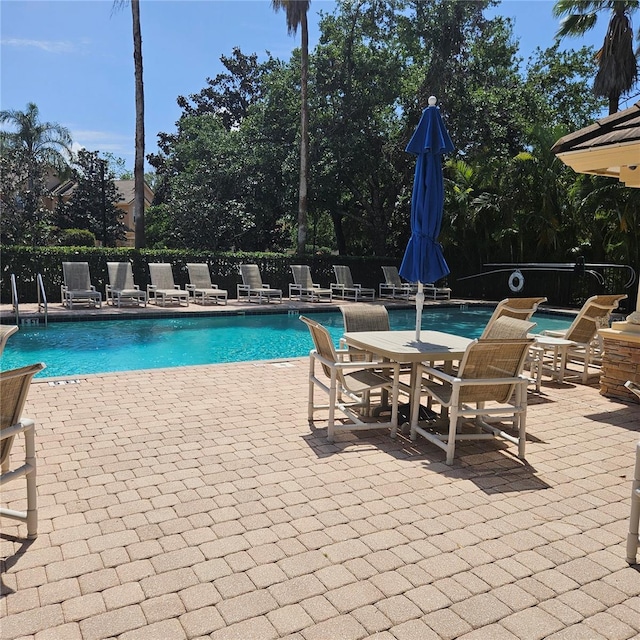 8110 Villa Grande Ct, Sarasota, FL 34243 - community pool with a patio area