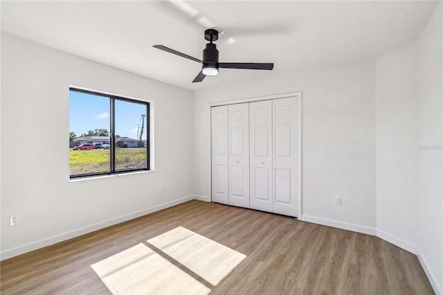 3239 Daytona Dr, Punta Gorda, FL 33983 - unfurnished bedroom with wood finished floors, baseboards, and a closet