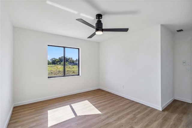3239 Daytona Dr, Punta Gorda, FL 33983 - empty room with light wood-style floors, baseboards, and ceiling fan