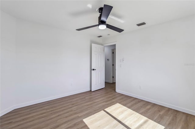 3239 Daytona Dr, Punta Gorda, FL 33983 - spare room with wood finished floors, baseboards, and ceiling fan