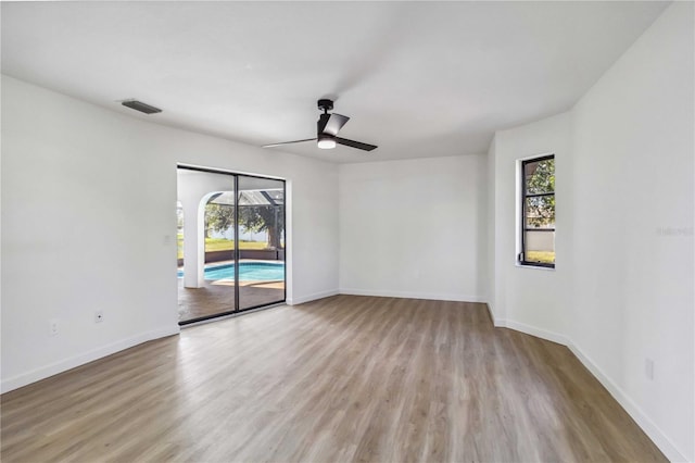 3239 Daytona Dr, Punta Gorda, FL 33983 - spare room with ceiling fan, healthy amount of natural light, wood finished floors, and baseboards