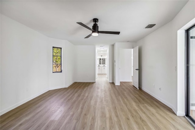 3239 Daytona Dr, Punta Gorda, FL 33983 - unfurnished bedroom with light wood finished floors, baseboards, ensuite bathroom, and a ceiling fan