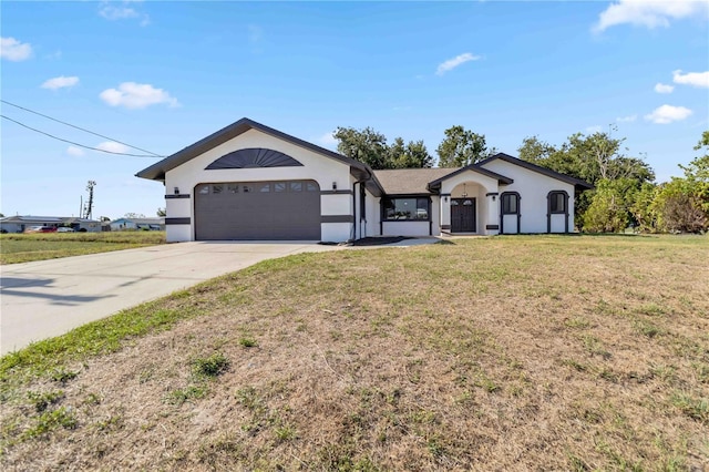 3239 Daytona Dr, Punta Gorda, FL 33983 - ranch-style house featuring stucco siding, a garage, driveway, and a front lawn