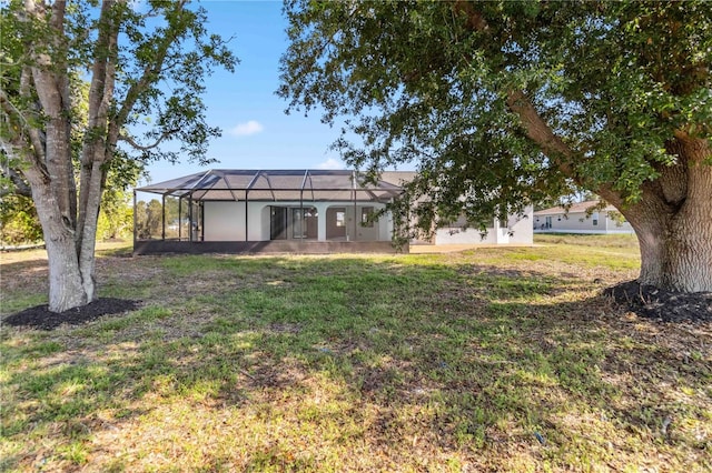 3239 Daytona Dr, Punta Gorda, FL 33983 - rear view of house with a yard and a lanai