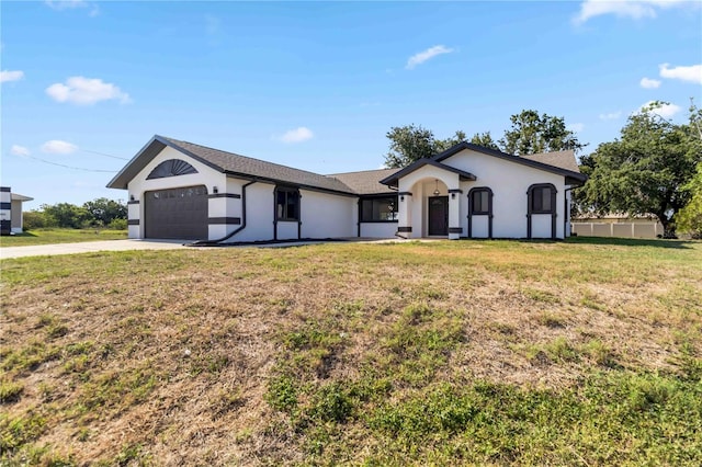 3239 Daytona Dr, Punta Gorda, FL 33983 - ranch-style home featuring an attached garage, stucco siding, driveway, a front lawn, and roof with shingles