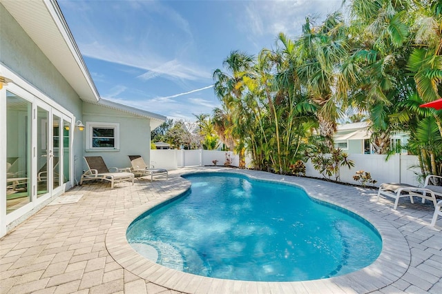 112 Palm Ave, Anna Maria, FL 34216 - view of pool featuring a patio area, a fenced backyard, and french doors