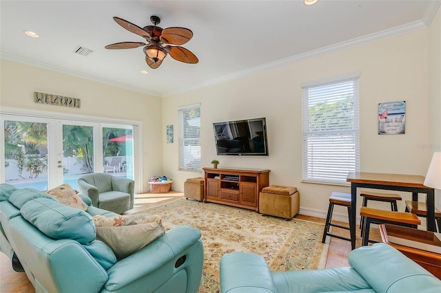 112 Palm Ave, Anna Maria, FL 34216 - living room with a ceiling fan, wood finished floors, french doors, ornamental molding, and baseboards